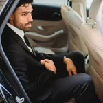 A person sitting in a limousine